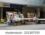 Small photo of Hanoi, Vietnam - Nov 16, 2014: Exterior view of book stores in Dinh Liet street. Selling on sidewalk is common in Hanoi, Vietnam