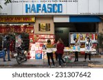 Small photo of Hanoi, Vietnam - Nov 16, 2014: Exterior view of book stores in Dinh Liet street. Selling on sidewalk is common in Hanoi, Vietnam