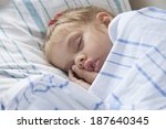 Small photo of A child of four years old sleeps in a parlor car trains. Portrait