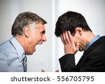 Angry boss shouting to an employee