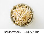 Bean sprouts in a green ceramic bowl with white background