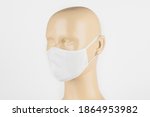 White Fabric Face Mask On A...