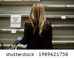 woman hoarding food during... | Shutterstock . vector #1989621758