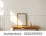 Blank wooden frame on a bench in a modern living room