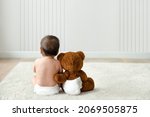 Baby And Teddy Bear Rear View...