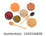 Various types of pulses, shot from the top on a white background. Red kidney, pinto, and black beans, lentils, chickpeas, soybeans, and black-eyed peas