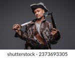 Small photo of A charismatic pirate with a weathered beard sporting a waistcoat and hat, brandishing a musket and saber, posing casually against a textured gray wall