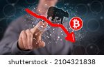 Small photo of Man touching a bitcoin bearish trend concept on a touch screen with his finger
