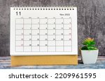 The November 2022 Monthly desk calendar for 2022 year with plant pot.