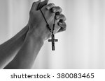 Praying Hands Holding A Rosary.