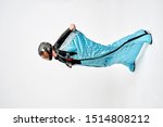 Small photo of Wingsuit flying. Wing Men in wing suit templet. Skydiving men in parashute. Simulator of free fall.