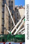 Small photo of New York, NY - Aug 18, 2023: Mobile supports are used to buttress a weak wall of a residential building on lower Fifth Avenue.