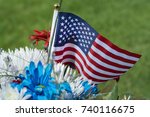 American Flag And Flowers On...