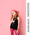 Small photo of Thoughtful preschool girl looking up propping her cheek with hand while trying to make a desicion. Three quarter length portrait isolated on pink. Children, emotions, snappy dresser, hard desicion