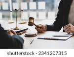 Small photo of Lawyer is explaining the terms of the legal contract document and asking the client to sign it properly. Legal counsel and legal proceedings consulting services.