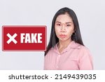 Photo of a female person identified as a fake. Facial recognition and deepfake detection software concept.