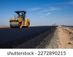 Small photo of Kyzylorda province, Kazakhstan, April 29, 2012: Caterpillar asphalt compactor flatten asphalt. Construction of West Europe-West China highway