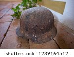 Rusted german helmet with two bullet holes