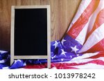 chalkboard and usa flag on... | Shutterstock . vector #1013978242