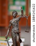 Small photo of Scales of Justice, the symbol of a statue of blindfolded Themis, tools used to remain balanced and pragmatic. Goddess also has a sword. Court, human rights, advocacy, lawyering and education concept