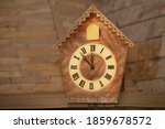 Old Clock On A Wooden Light...