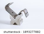 Small photo of Sheet metal bending tool and equipment isolated on a white background. Special Bending machine Forming mold punch and die. Press brake tools, bend tools, press brake punch and die.
