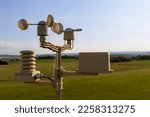 Small photo of anemometer, wind speed measurement, small weather station. Anemometer on blue sky.