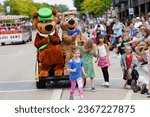 Small photo of Wisconsin Dells, Wisconsin USA - September 20th, 2023: People dressed up in Yogi Bear and Boo boo bear costumes and interacted with the children at a parade.