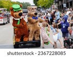 Small photo of Wisconsin Dells, Wisconsin USA - September 20th, 2023: People dressed up in Yogi Bear and Boo boo bear costumes and interacted with the children at a parade.
