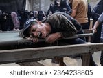 Small photo of Palestinians mourn the body of a young man, who was shot dead by Israeli forces, in the southern Gaza Strip, on September 20, 2023.