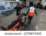 Small photo of The wounded Palestinians arrive at Al-Najjar Hospital after an Israeli raid on their home in the city of Rafah, southern of Gaza Strip, on October 23, 2023.