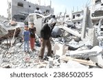 Small photo of Palestinians inspect their house, after it was destroyed by an Israeli air strike on the city of Rafah in the southern Gaza Strip, on November 10, 2023.