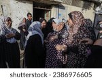Small photo of Palestinian women mourn their relatives who were killed by Israeli warplanes, in the city of Rafah in the southern Gaza Strip, on November 11, 2023.