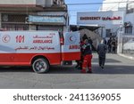Small photo of Palestinian Red Crescent first aid waiting to receive bodies from Al-Najjar Hospital in the city of Rafah, south of the Gaza Strip, on January 10, 2024.
