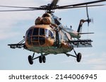 Small photo of Kecskemet, Hungary - August 28, 2021: Military helicopter at air base. Air force flight transportation. Aviation and rotorcraft. Transport and airlift. Military industry. Fly and flying.