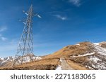 Small photo of Electricity pylons, in a mountain place. Origin, transport and need for electricity. Environmental defacement. Eletricity grid.