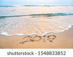 Small photo of Number 2019 written on the sand of the sea The concept of the old year that is passing away