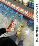 Small photo of BAKU, AZERBAIJAN – OCTOBER 8, 2020: Woman shopping in supermarket, shopping bag with Danone yogurt and Chocolate butter