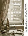 Small photo of MOSCOW, RUSSIA - JULY 14,2019: Soviet still life. Old kitchen, bottles of beer "Zhigulevskoe", vobla and the newspaper "Komsomolskaya Pravda".