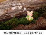 lucky pig in the moss for good wishes in german text  who means happy new year