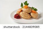 Gefilte fish with carrot. Plate of traditional Passover Pesach gefilte fish on table