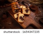 Marble loaf cake with cocoa on rustic wooden board