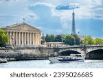 Small photo of Paris, France - June 25, 2023 : Assemblee Nationale building on the quays of the river Seine and Eiffel Tower in Paris, France