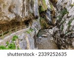 Small photo of Path of the Cares river, road built in the rock based on tunnels, in the gorge near the Cain dam.