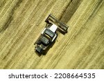 a combine harvester harvesting a field of wheat rural landscape. High quality photo