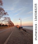 Small photo of Sunset at waterfront bicycle, inline skating, skateboarding, running, pedestrian path along lake Ontario (martin goodman trail). Urban environment of Toronto City.