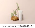 Composition from the natural materials and cosmetics tube near it.Copy space for text or design.Can be used as advertising banner.Pastel colors.Mockup concept.