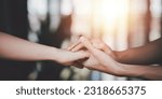 Small photo of Husband and wife join hands to cheer ,Relationship care concept ,comforting family members ,mutual encouragement ,tenderness ,comfort and sympathy ,helping ,giving hope and believing