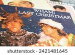 Small photo of Viersen, Germany - January 9. 2024: Closeup of band Wham vinyl record single cover Last christmas from 1984 (focus on center)