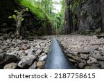 Small photo of Hellfire pass (Chong khaokaht) of Death Railway in valley mountain that was built cruelly by prisoners of war built during World war 2 at Kanchanaburi. Thailand, Focus and blur.